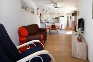 a living room with a couch and a table at Bellavista 2 in Alquézar