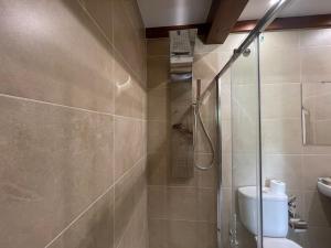 O baie la La Era de Lario habitación con Jacuzzi