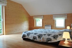 Un pat sau paturi într-o cameră la Gite Le Greillis