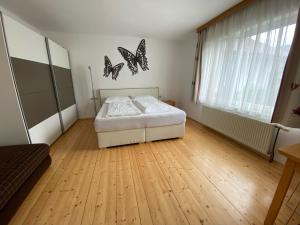 Postel nebo postele na pokoji v ubytování Bungalow Grabner