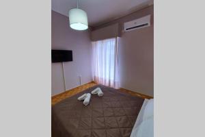 Posteľ alebo postele v izbe v ubytovaní Greek hospitality in a modern apartment + 5 fotografií