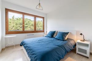 En eller flere senge i et værelse på Leï Tapenié 2 par Dodo-a-Cassis