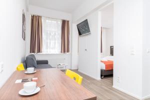 Televízia a/alebo spoločenská miestnosť v ubytovaní Apartments Favoriten