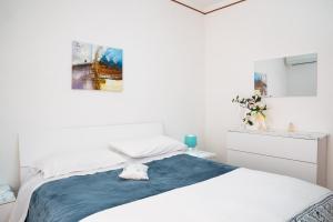 Ліжко або ліжка в номері Casa di Rosa