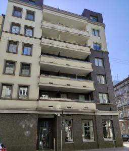an apartment building in the middle of a street at Elegant & Cosy in Wrocław