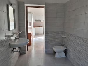 a bathroom with a sink and a toilet at La Marina Bay in Vieste +27 photos