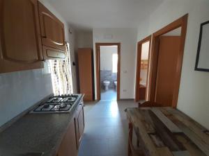 a kitchen with a stove and a counter top at La Marina Bay in Vieste