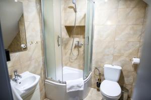 Kúpeľňa v ubytovaní Apartamenty Centrum Biskupiec