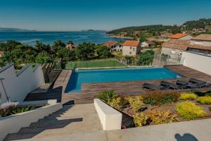 an aerial view of a house with a swimming pool at Chalet Mirador da Pinela in Cangas de Morrazo