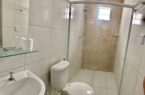 a bathroom with a toilet and a sink and a shower at Amigos da Praia in Fortaleza
