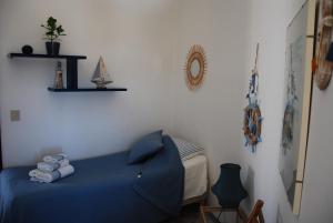 a bedroom with a blue bed in a room at Villa Ada in Francavilla al Mare