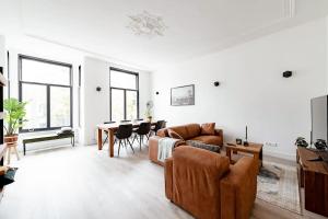 a living room with a couch and a table at LVM Stays in The Hague