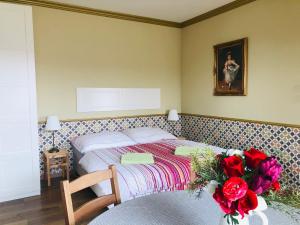 Tempat tidur dalam kamar di Apartmánový dom Andalusia