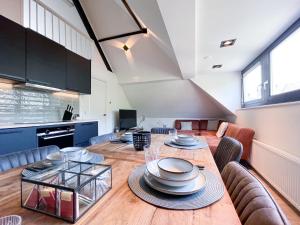 a dining room with a table with plates on it at LVM Stays in The Hague