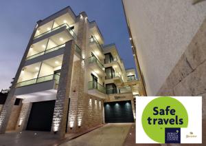 a building with a sign that reads safe travels at Barjaktar - Luxury Suites & SPA in Ulcinj