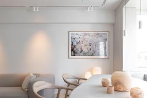 Posezení v ubytování Een designappartement met zijdelings zicht op zee