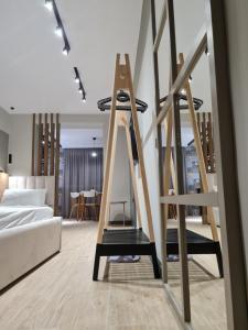 a room with a bed and twoadders in a room at TAM Center Studio Apartment Next To Blloku No1 in Tirana