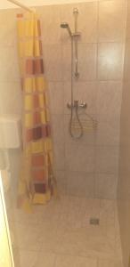 a bathroom with a shower with a shower curtain at Relax Črni Kal 3 in Črni Kal