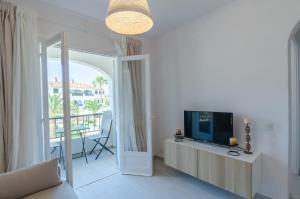 TV a/nebo společenská místnost v ubytování Apartamento holidays