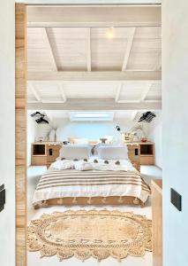 a large bedroom with a large bed with a rug at Santa Lucia Maccarese - Residenza Agricola in Maccarese