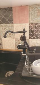 a kitchen sink with a faucet and a sink at Villa Rosa Boutique in Almancil +40 photos