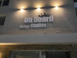 a sign on the wall of an on board improv studios at On Board Luxury Studios in Sarti