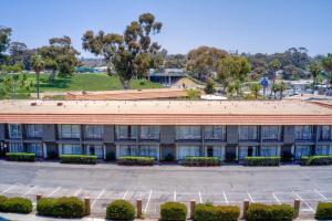 an aerial view of a building with a parking lot at Best Western Oceanside Inn in Oceanside