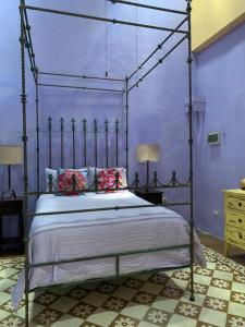 Ένα ή περισσότερα κρεβάτια σε δωμάτιο στο Catrina & Diego