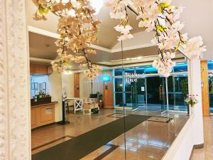 a lobby with a glass floor with flowers on the ceiling at Villae Resort in Jeju