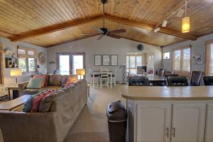 a living room with a couch and a ceiling fan at 117 Fourth St, Bethany Beach in Bethany Beach