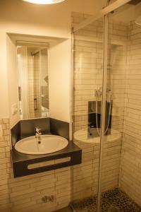 a bathroom with a sink and a shower at 4nudos playa in San José +31 photos