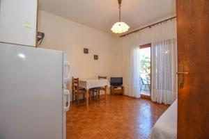 Kuchyň nebo kuchyňský kout v ubytování Apartments Immortelle