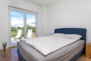 Una cama o camas en una habitación de Villa MALI RAJ