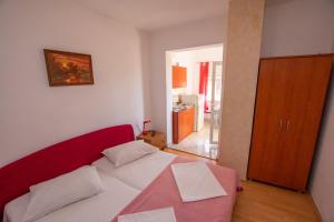 Ένα ή περισσότερα κρεβάτια σε δωμάτιο στο Apartments Calida B