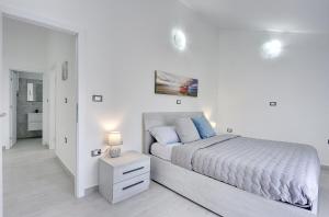 Posteľ alebo postele v izbe v ubytovaní Villa Residence Oli A