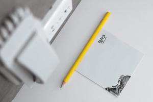 a pencil sitting on top of a piece of paper at YELLO Hotel Kuta Beachwalk Bali in Kuta