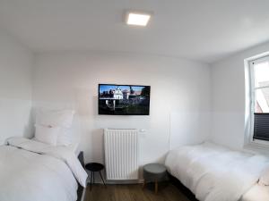 Säng eller sängar i ett rum på Landhaus Amelinghausen Ferienwohnung