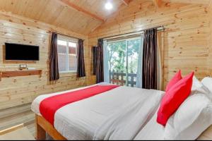 Postel nebo postele na pokoji v ubytování Coorg amodhini