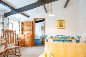 a dining room with a table and chairs at Hele Bay Cottage in Ilfracombe