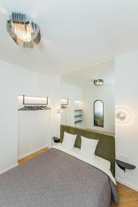 Lova arba lovos apgyvendinimo įstaigoje Kaunas Town Hall apartment 5A by URBAN RENT