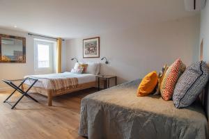 מיטה או מיטות בחדר ב-Verdon Appartement Notre "Chez Vous"