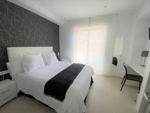 Posteľ alebo postele v izbe v ubytovaní Hostal Somnis