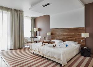 Ein Bett oder Betten in einem Zimmer der Unterkunft Hotel Diva SPA