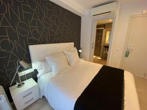 Posteľ alebo postele v izbe v ubytovaní Hostal Somnis