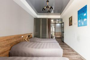 a bedroom with two beds in a room at Veli group Apartment in Old City in Kutaisi