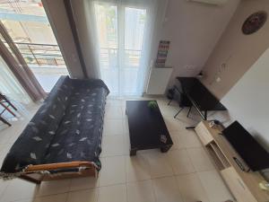 Televízia a/alebo spoločenská miestnosť v ubytovaní Seaside Beach Apartment