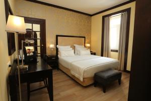Cama ou camas em um quarto em Hotel Inglaterra - Charme & Boutique