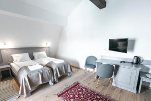 Ένα ή περισσότερα κρεβάτια σε δωμάτιο στο Veranda Panzio