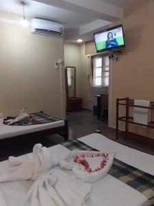 Postel nebo postele na pokoji v ubytování Anura Guest Inn