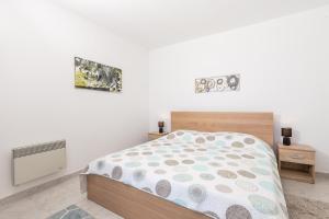 Postel nebo postele na pokoji v ubytování Apartments Vilma